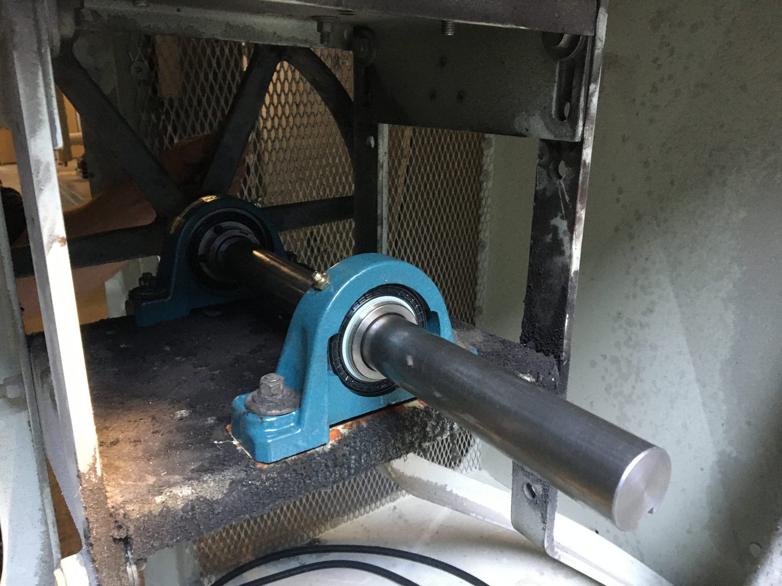 Fan shaft and pillow block bearing being replaced in a commercial air handler