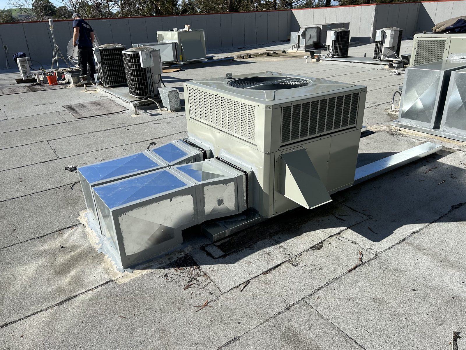 Replacement packaged unit with new sheet metal sleeper caps and rooftop plenums